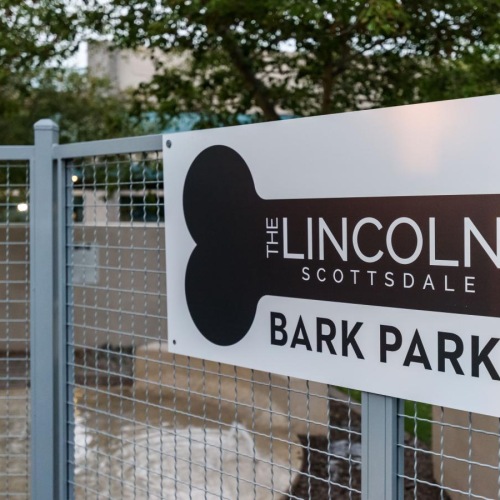 a sign on a fence