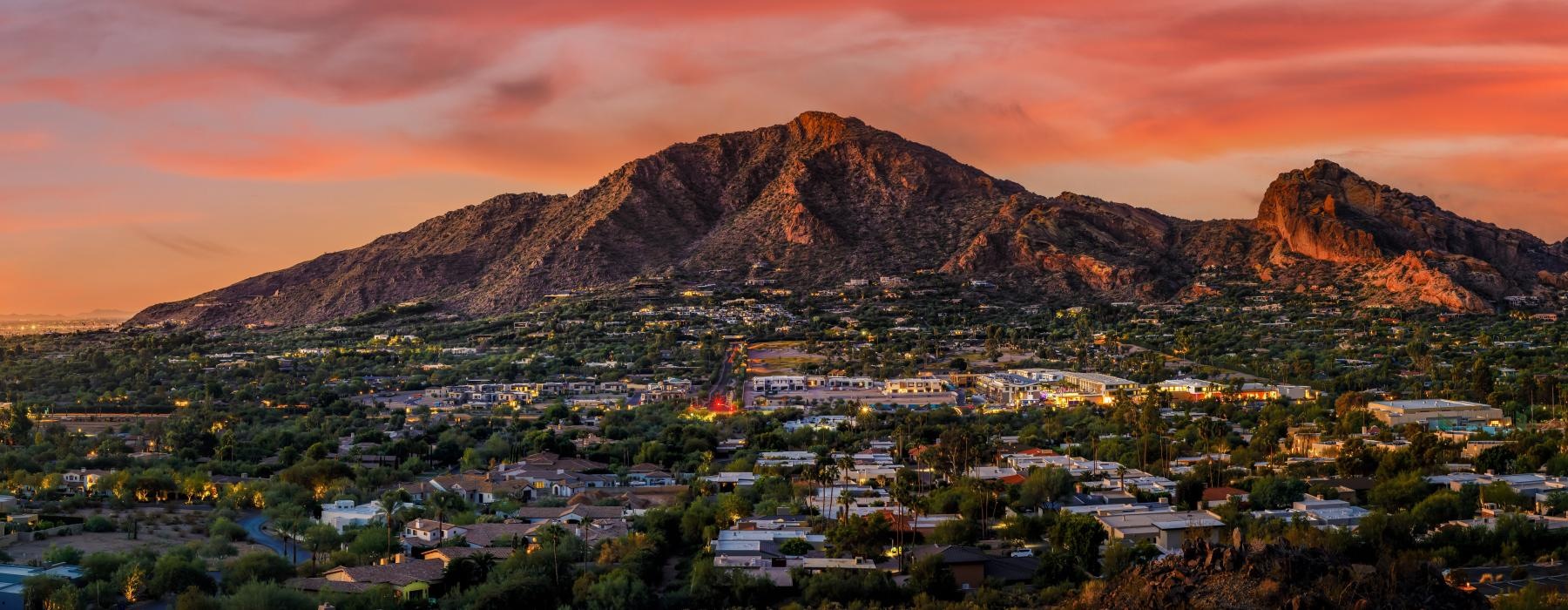 a city with mountains in the background