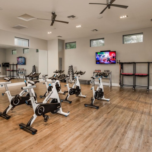 a room with a few stationary bikes
