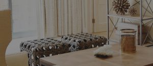 Bench and chair in living room at The Lincoln Scottsdale apartments